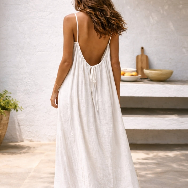 Full length view of women's flowy spaghetti strap maxi sundress, ideal for comfortable summer style.