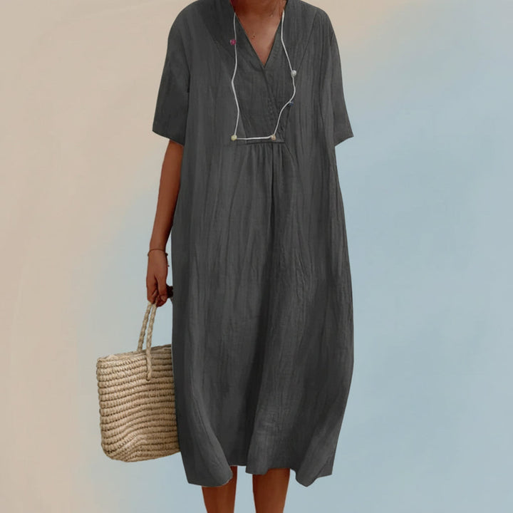 Soft, easy-care women's flowy summer midi dress, a comfortable V-neck A-line for daily wear or travel.