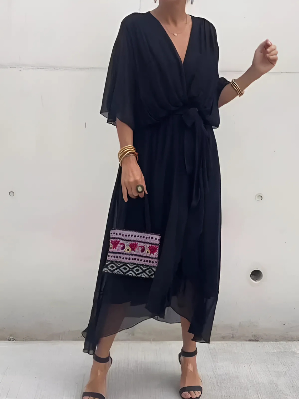 Plus size women's flowy V-neck maxi dress with belt, a comfortable & elegant option for any occasion.