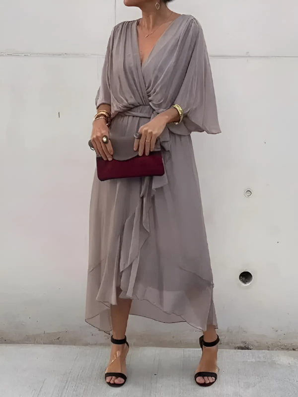 Women's flowy V-neck maxi dress with a flattering belt, an essential for elegant spring & summer style.