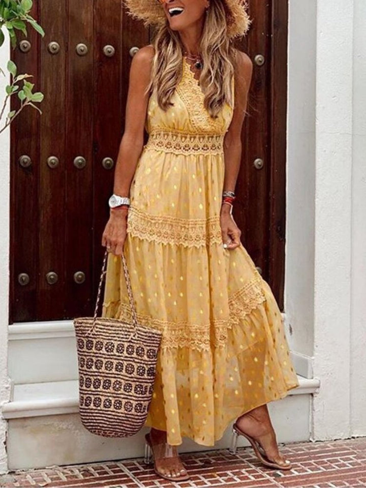 Woman in a flowy V-neck boho summer dress, perfect for beach vacations, resort wear, or effortless casual style.