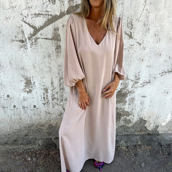 Long flowy V-neck maxi dress for women, featuring stylish balloon sleeves and a comfortable design.