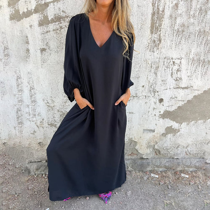 Comfortable women's flowy V-neck maxi dress with balloon sleeves, ideal for casual spring and summer fashion.