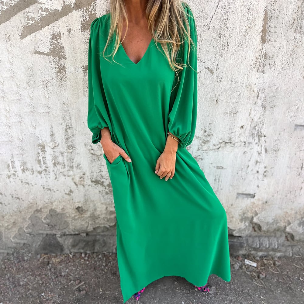 Boho-chic women's flowy V-neck maxi dress, featuring trendy balloon sleeves for elegant summer fashion.