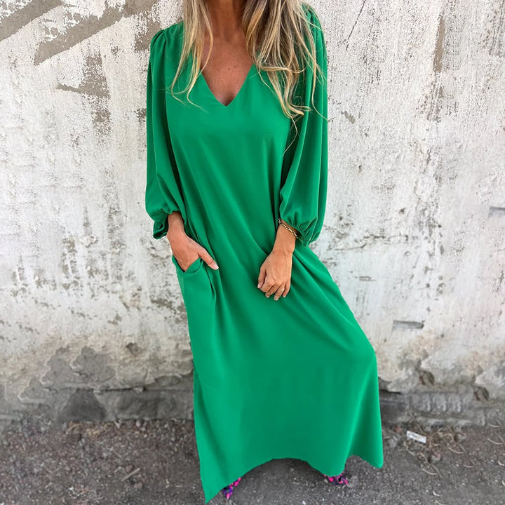 Boho-chic women's flowy V-neck maxi dress, featuring trendy balloon sleeves for elegant summer fashion.