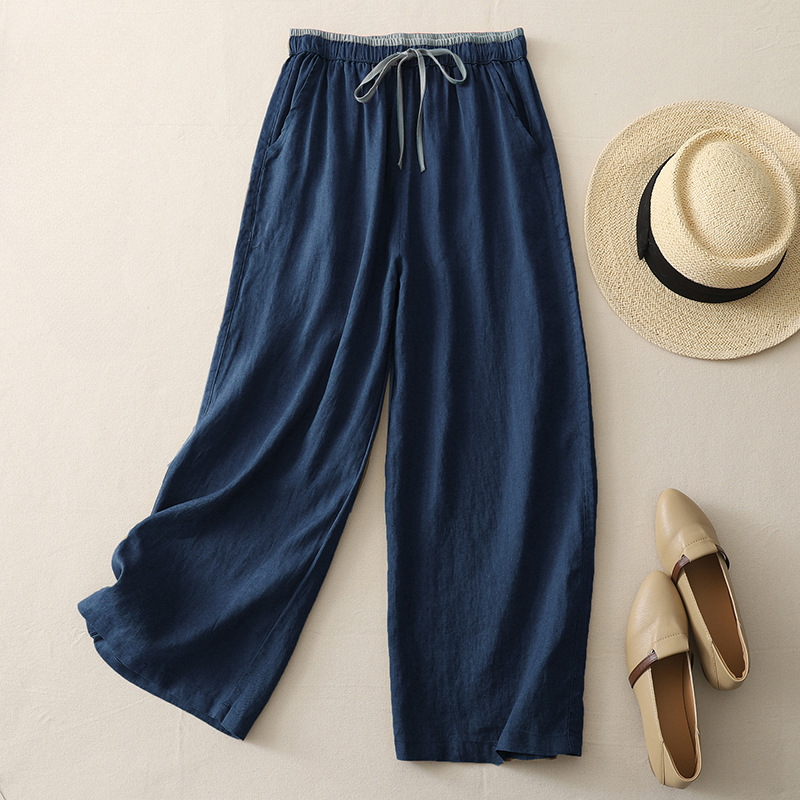 Effortless apricot wide-leg flowy pants for women, ideal for spring fashion, everyday style, and vacation wear.