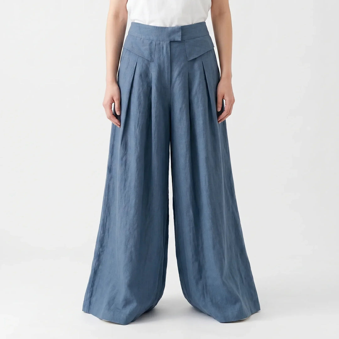 Woman walking in comfortable, flowy wide leg summer pants, showcasing relaxed fit and airy fabric movement.