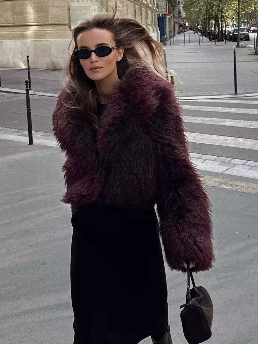 Cozy women's short fluffy jacket made from soft imitation fur, offering ultimate comfort for winter.