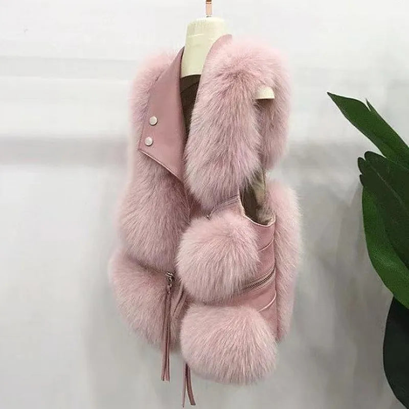 Elegant women's faux fur vest, perfect for stylish layering & transitional wear. A trendy sleeveless jacket.