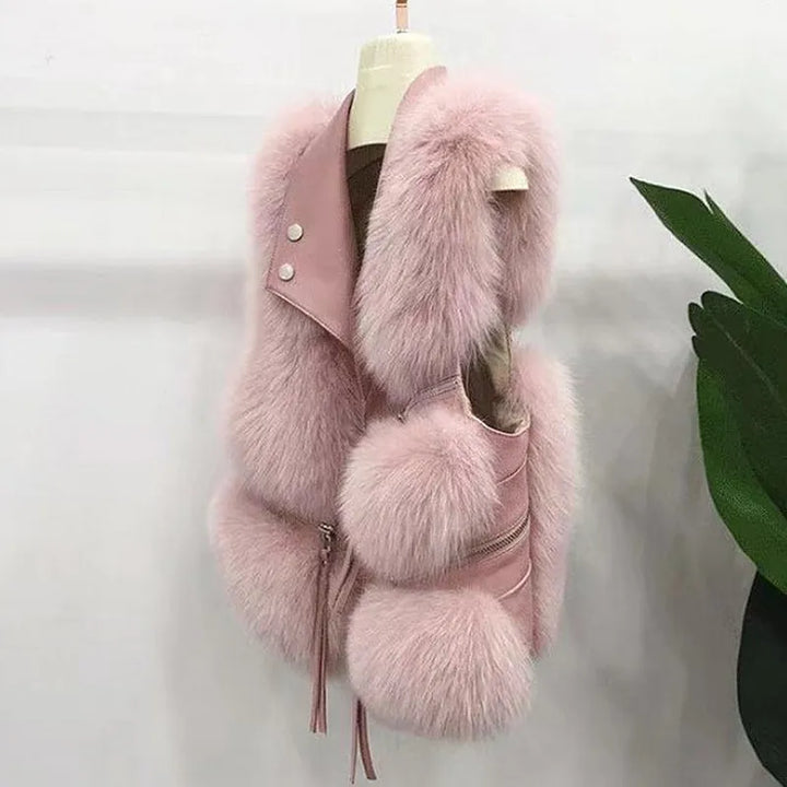 Elegant women's faux fur vest, perfect for stylish layering & transitional wear. A trendy sleeveless jacket.