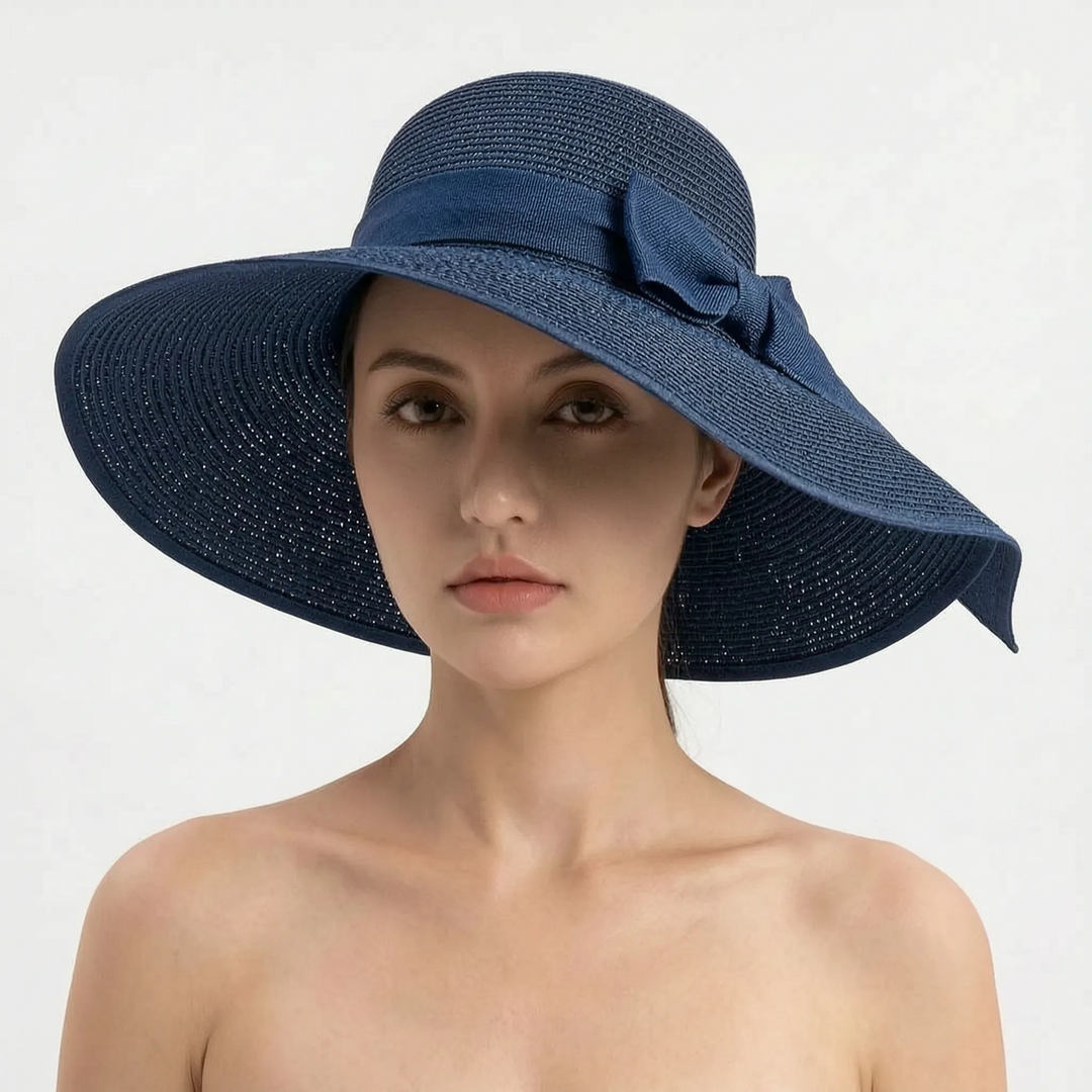 Comfortable women's wide brim sun hat, foldable for easy travel & stylish summer sun protection.