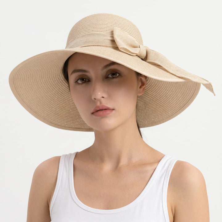 Khaki women's foldable wide brim sun hat. Ideal for sun protection during beach or travel.