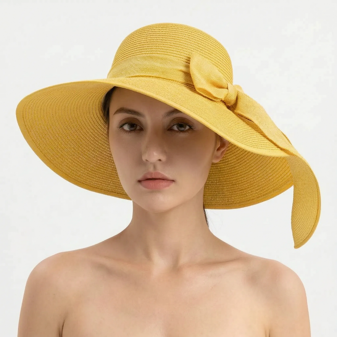 Women's wide brim sun hat, foldable for ultimate sun protection on vacation, beach & summer days.