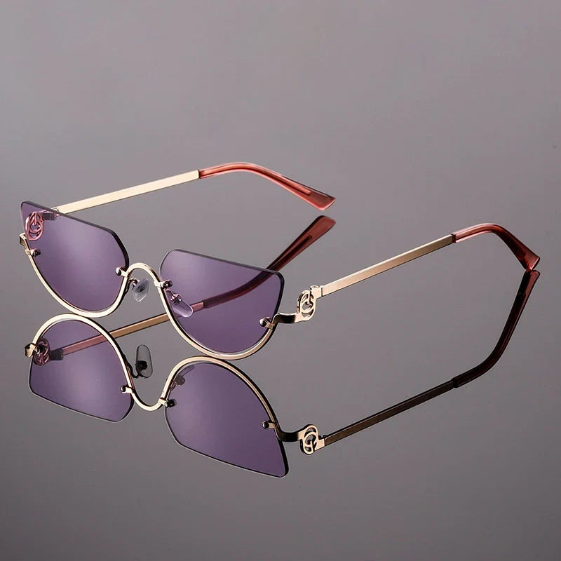 Women's frameless angular sunglasses with bold modern design, metal frame, and UV protection for a trendy look.