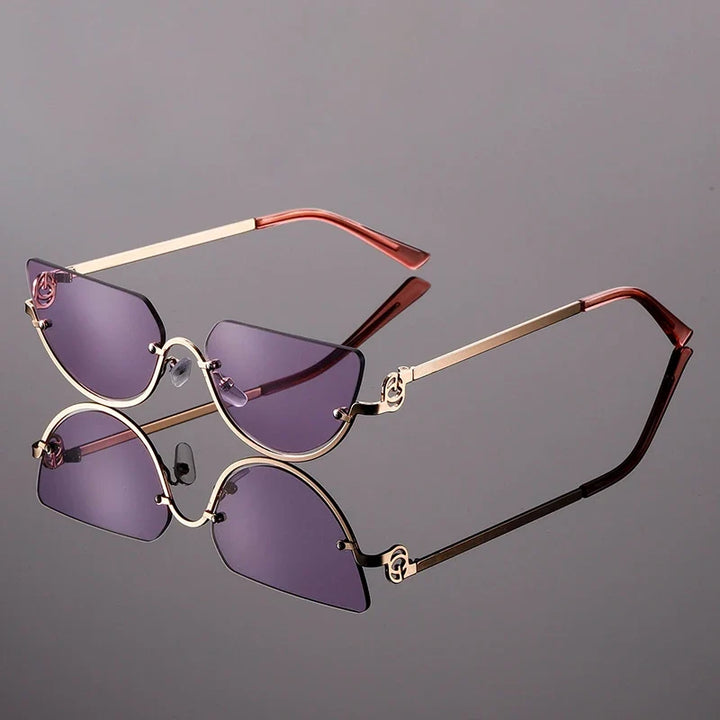 Women's frameless angular sunglasses with bold modern design, metal frame, and UV protection for a trendy look.