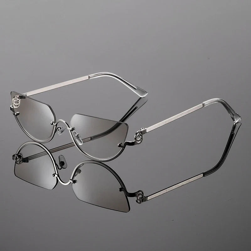 Trendy women's frameless angular sunglasses featuring a sleek metal frame & adjustable nose pads for modern fashion.