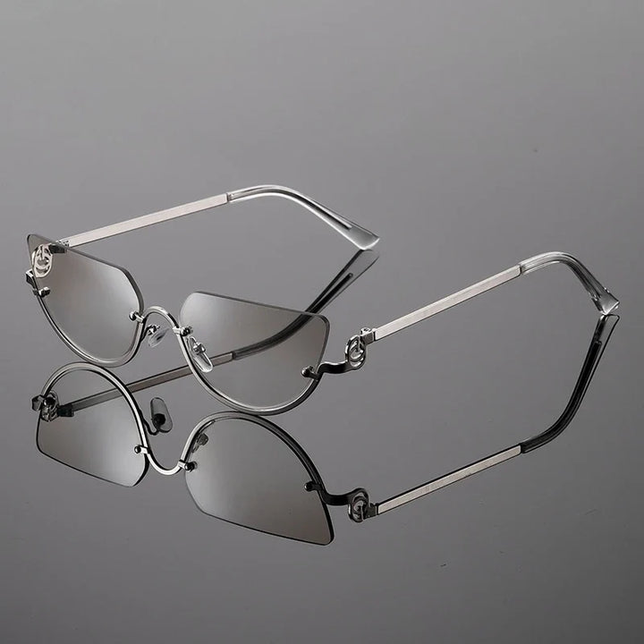 Trendy women's frameless angular sunglasses featuring a sleek metal frame & adjustable nose pads for modern fashion.
