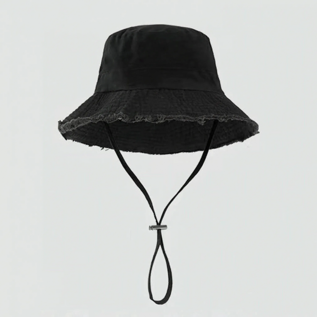 Fashionable women's bucket hat with a distinctive frayed brim. Perfect for relaxed summer outfits & sun.