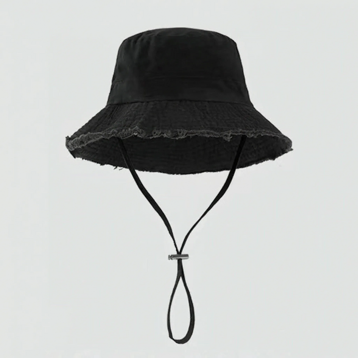 Fashionable women's bucket hat with a distinctive frayed brim. Perfect for relaxed summer outfits & sun.