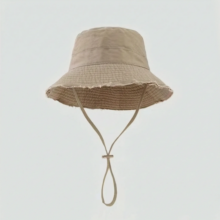 Lightweight women's frayed brim bucket hat, offering stylish sun protection for any summer adventure.