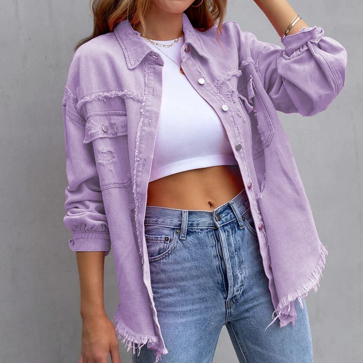 Comfortable women's frayed denim jacket, an effortless statement piece for casual style. Distressed fashion outerwear.
