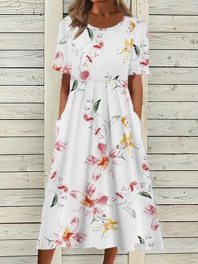 Fresh floral women's midi dress. A-line, round neck, short sleeve. Feminine summer and day dress.