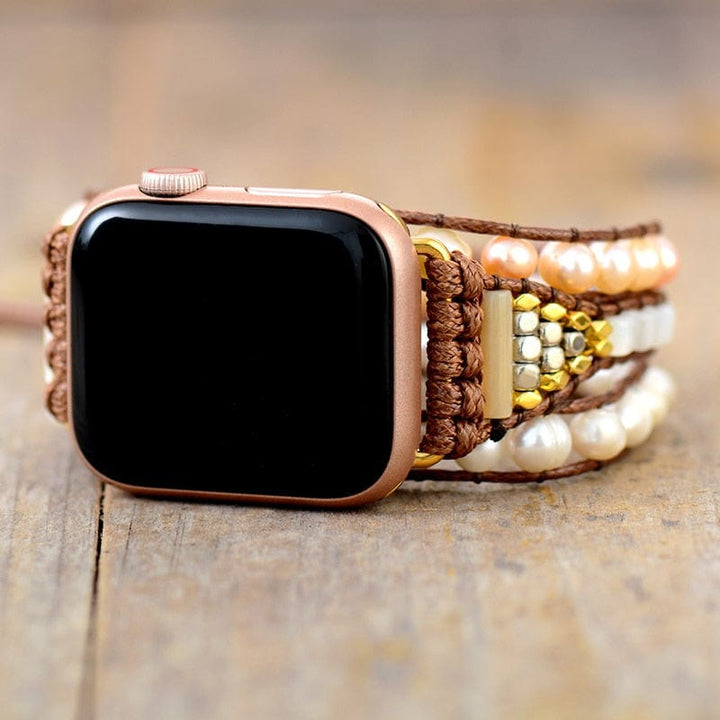 Stylish freshwater pearl multi-wrap Apple Watch band for women, a handmade boho smartwatch accessory.