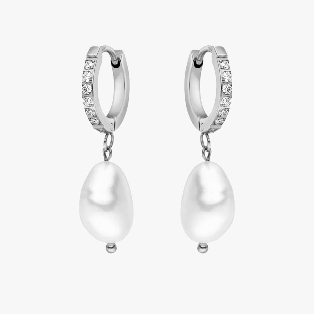 Classic silver freshwater pearl hoops, offering both elegance and comfort.