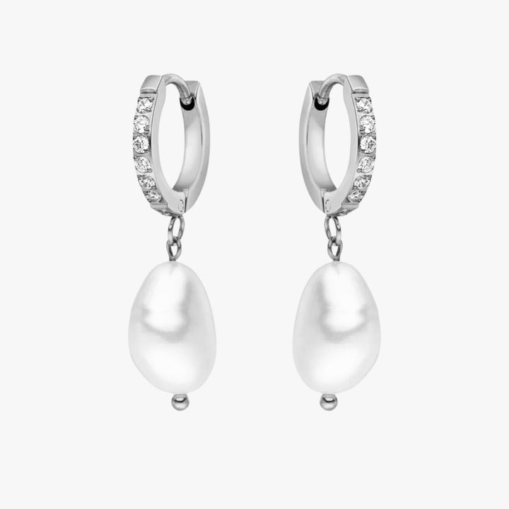Classic silver freshwater pearl hoops, offering both elegance and comfort.