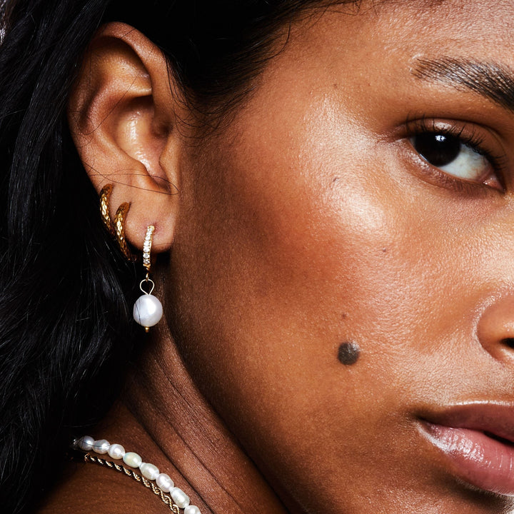 Hypoallergenic gold hoops with natural freshwater pearls, water resistant jewelry.