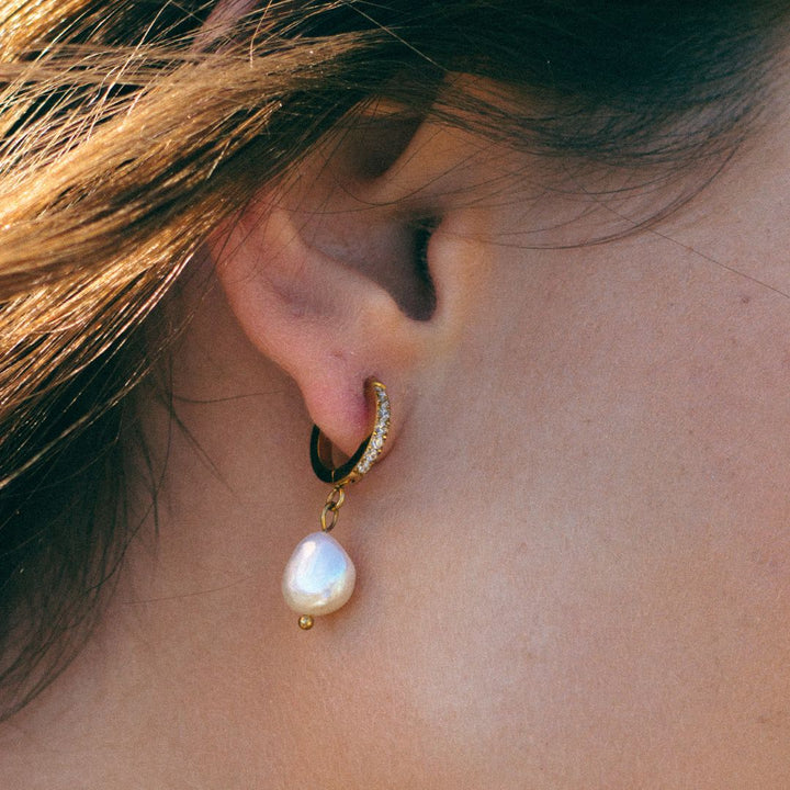 Dainty silver freshwater pearl hoop earrings, versatile women's jewelry.
