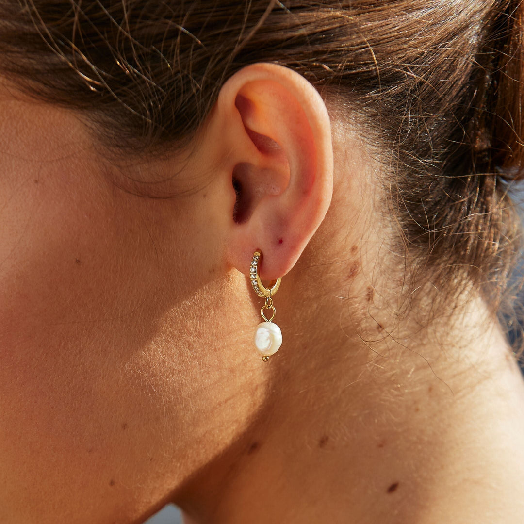 Timeless freshwater pearl hoop earrings, a stunning accessory for any woman.