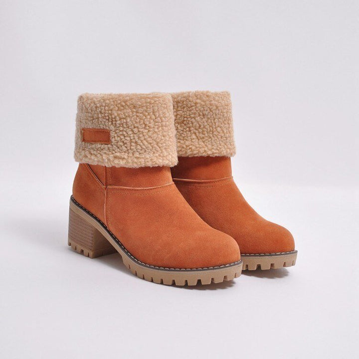 Women's warm FrostStep heeled ankle boots. Insulated winter footwear combining style, comfort, and cold protection.