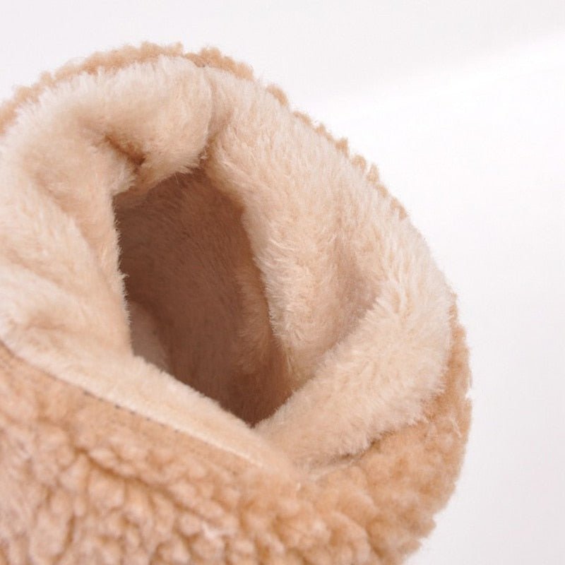 Women's FrostStep insulated winter ankle boots with stylish heel. Cozy, fashionable cold weather footwear.