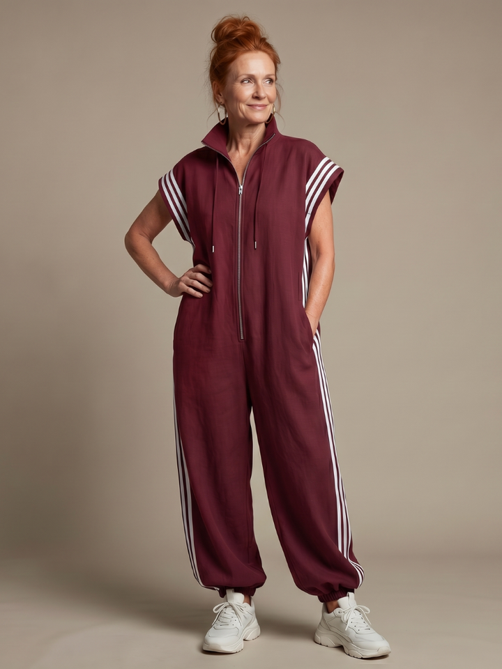 Women's full-length zip jumpsuit with sporty side stripes. Perfect for casual wear & modern style.
