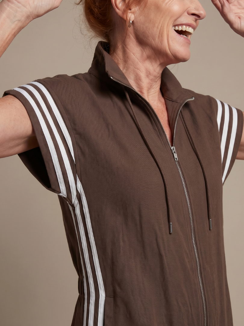 Comfortable women's full-length one-piece. Zip front, cap sleeves, high neck, and sporty side stripes.