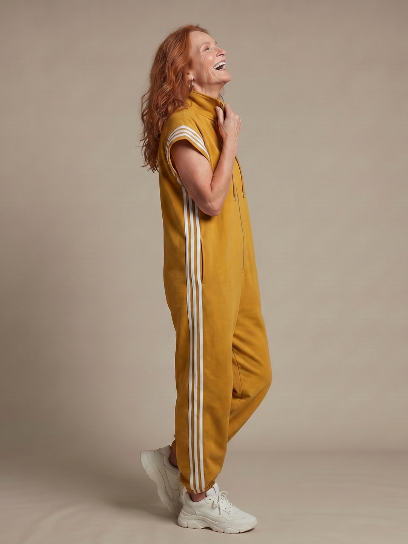Casual women's full-length jumpsuit. Zip-up design, comfortable fit, and trendy side stripe accents.