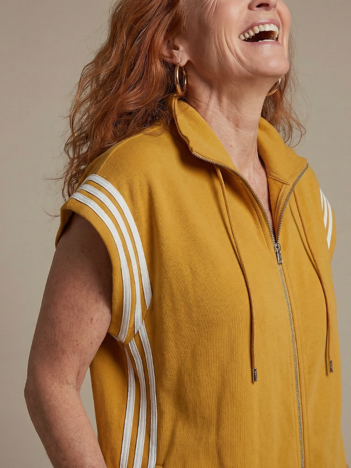 Women's full-length jumpsuit for a sporty chic look. Zip-front, high neck, and side stripe details.