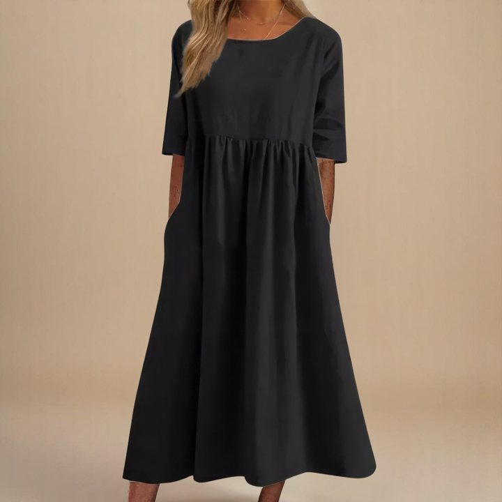 Casual summer midi dress with a comfortable gathered waist and stylish half-sleeves for versatile wear.