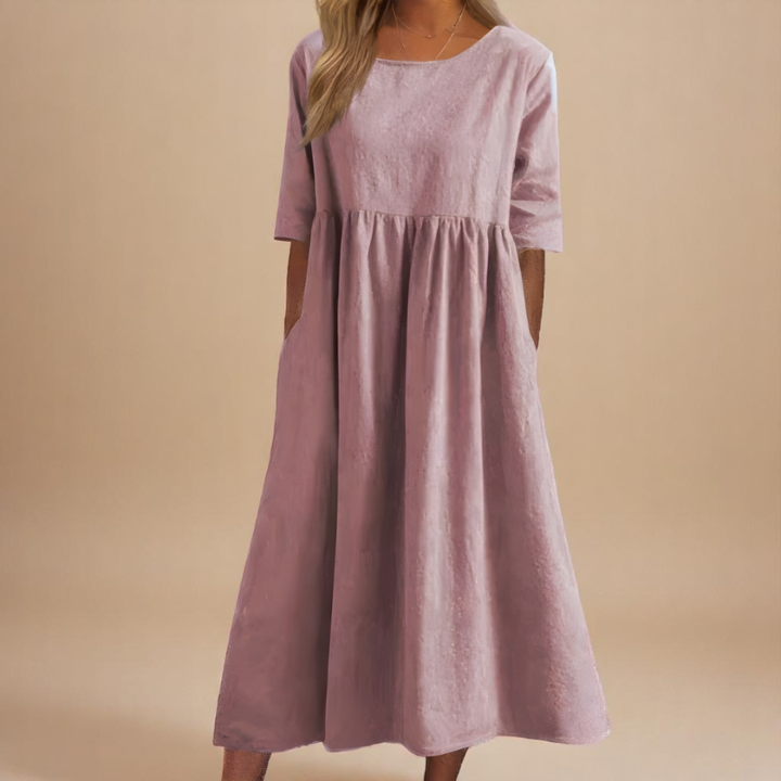 Versatile half-sleeve midi dress for women, featuring a flattering gathered waist and flowy silhouette.