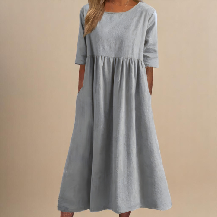 Everyday women's midi dress with a scoop neck, half-sleeves, and gathered waist, offering comfort & style.