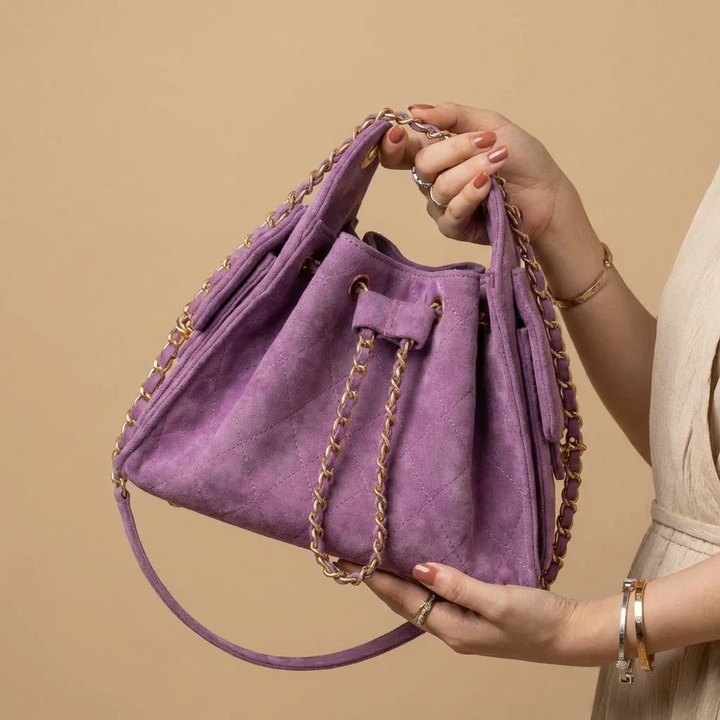 Chic genuine leather bucket shoulder bag for women, a fashionable everyday handbag.