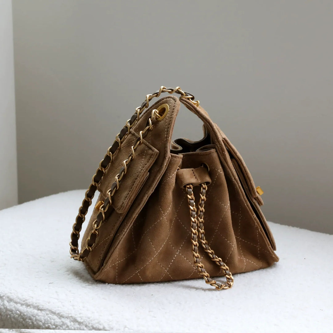 Elegant women's genuine leather bucket bag, a stylish shoulder handbag design.