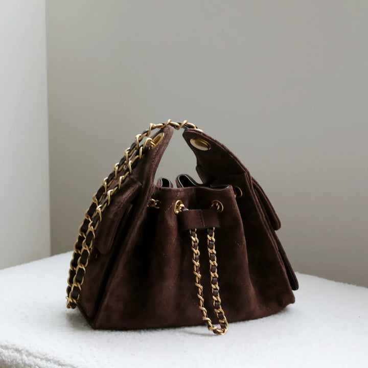 Versatile genuine leather bucket bag for women, ideal for everyday carry as a shoulder handbag.