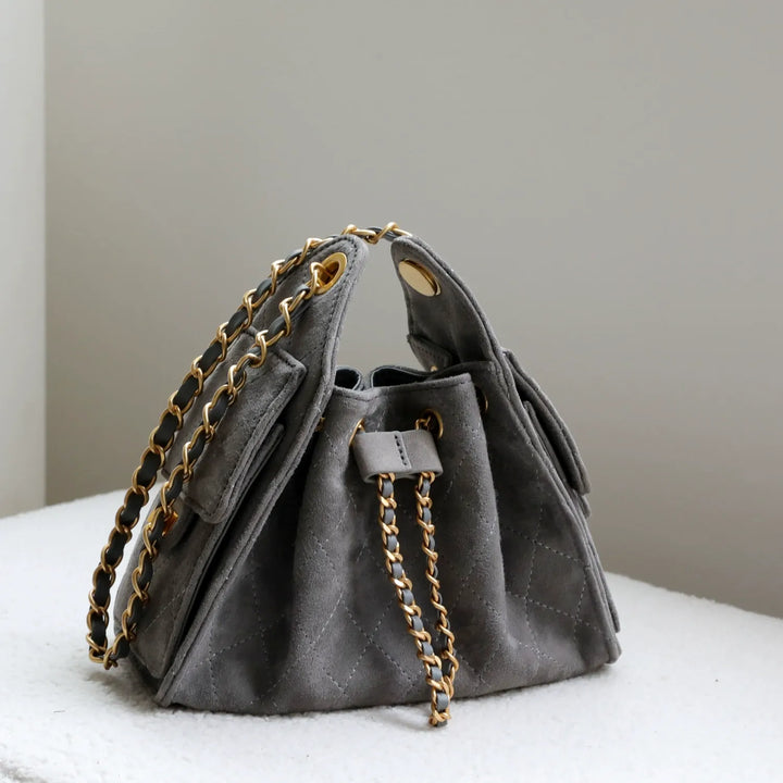 Luxurious genuine leather women's bucket shoulder bag, perfect for an elegant everyday look.