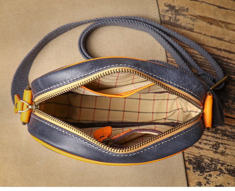 Women's genuine leather crossbody purse, a compact bag with an adjustable strap for everyday fashion.