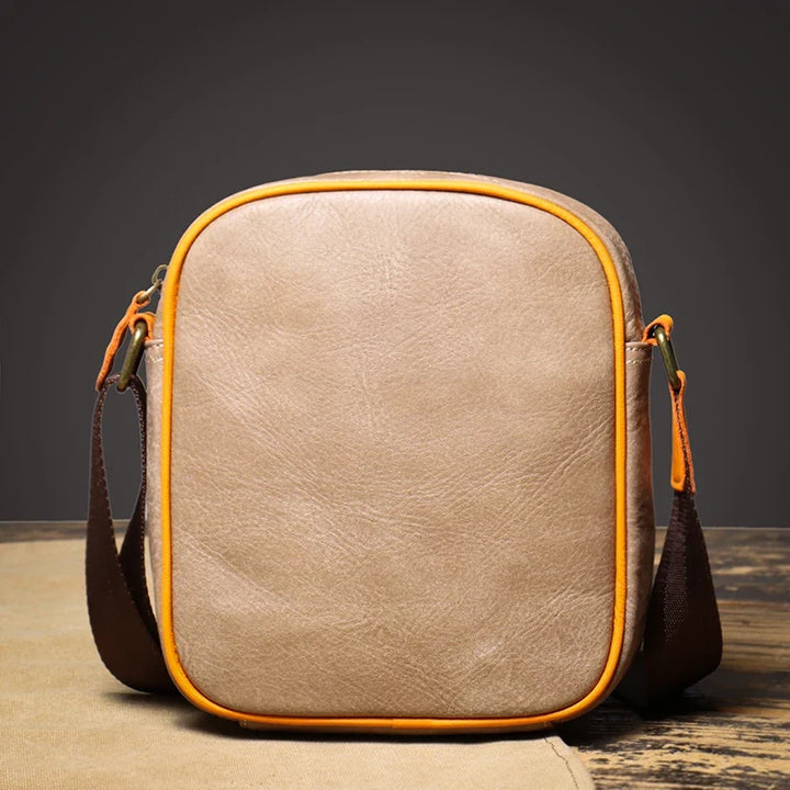 Compact genuine leather crossbody bag for women, versatile and stylish with an adjustable strap.