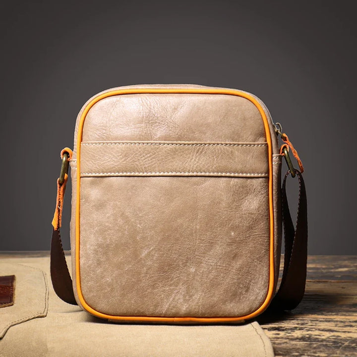 Versatile genuine leather women's crossbody bag, compact and comfortable with an adjustable strap.