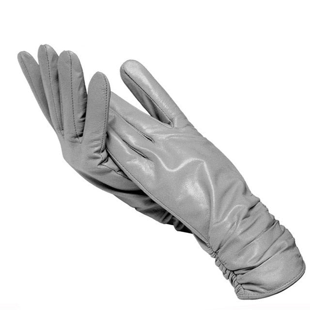 Elegant women's genuine leather fashion gloves, wrist length, perfect for a sophisticated look.