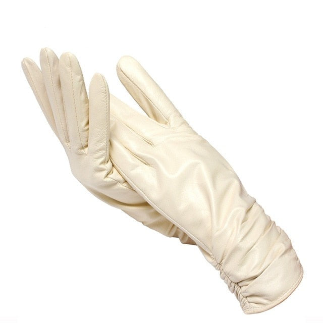 Stylish wrist-length genuine leather gloves for women, providing warmth and comfort in winter.